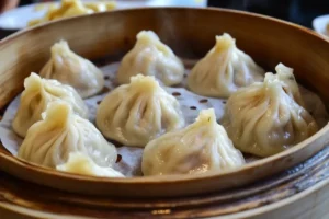 Served chicken soup dumplings in a bowl.