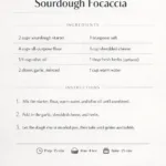 Freshly baked cheesy garlic sourdough focaccia bread with herbs