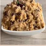 Bowl of eggless cookie dough ready to eat, safe for raw consumption.