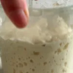 Freshly baked Sourdough Ciabatta Rolls on a wooden table