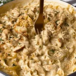 Dairy-free chicken Alfredo served in a bowl with parsley garnish