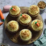 Gluten-free carrot cake cupcakes topped with cream cheese frosting