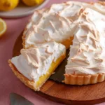 Gluten-free lemon meringue pie with a fluffy meringue topping and lemon filling.
