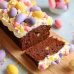 Mini egg loaf cake with frosting on a wooden table