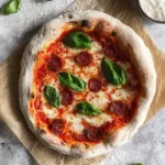 Freshly made Neapolitan pizza dough on a wooden table