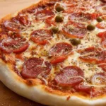 Homemade thin-crust pizza dough ready for topping and baking