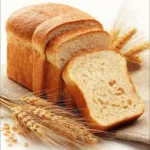 Three slices of wheat bread with wheat ears and grains on the side
