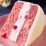 Delicious Vegan Strawberry Cake topped with fresh strawberries and creamy frosting